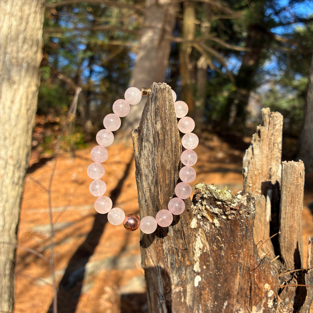 “Handmade rose quartz gemstone bracelet by Mysuvelas, symbolizing love, calm, and clarity, photographed in natural light.”